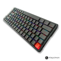 View of the Compact 84 key Keychron K2 wireless with RGB lightning. Connects with up to 3 devices. Windows/Mac Layout. Along with wired Type C mode.  Gaetron switches, ABS/PBT material and ANSI layout.